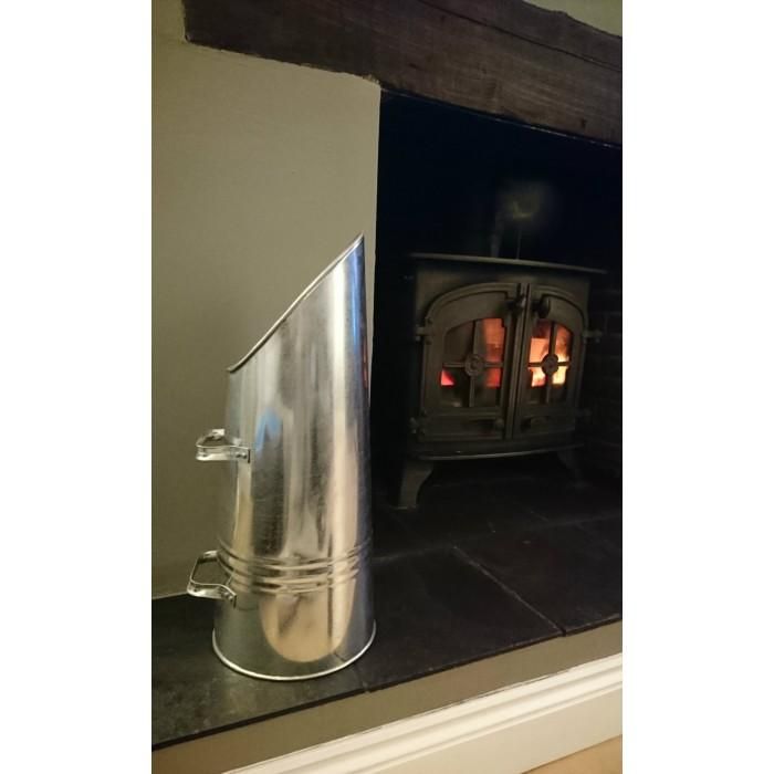 Traditional Coal Hod Next to the fire Place