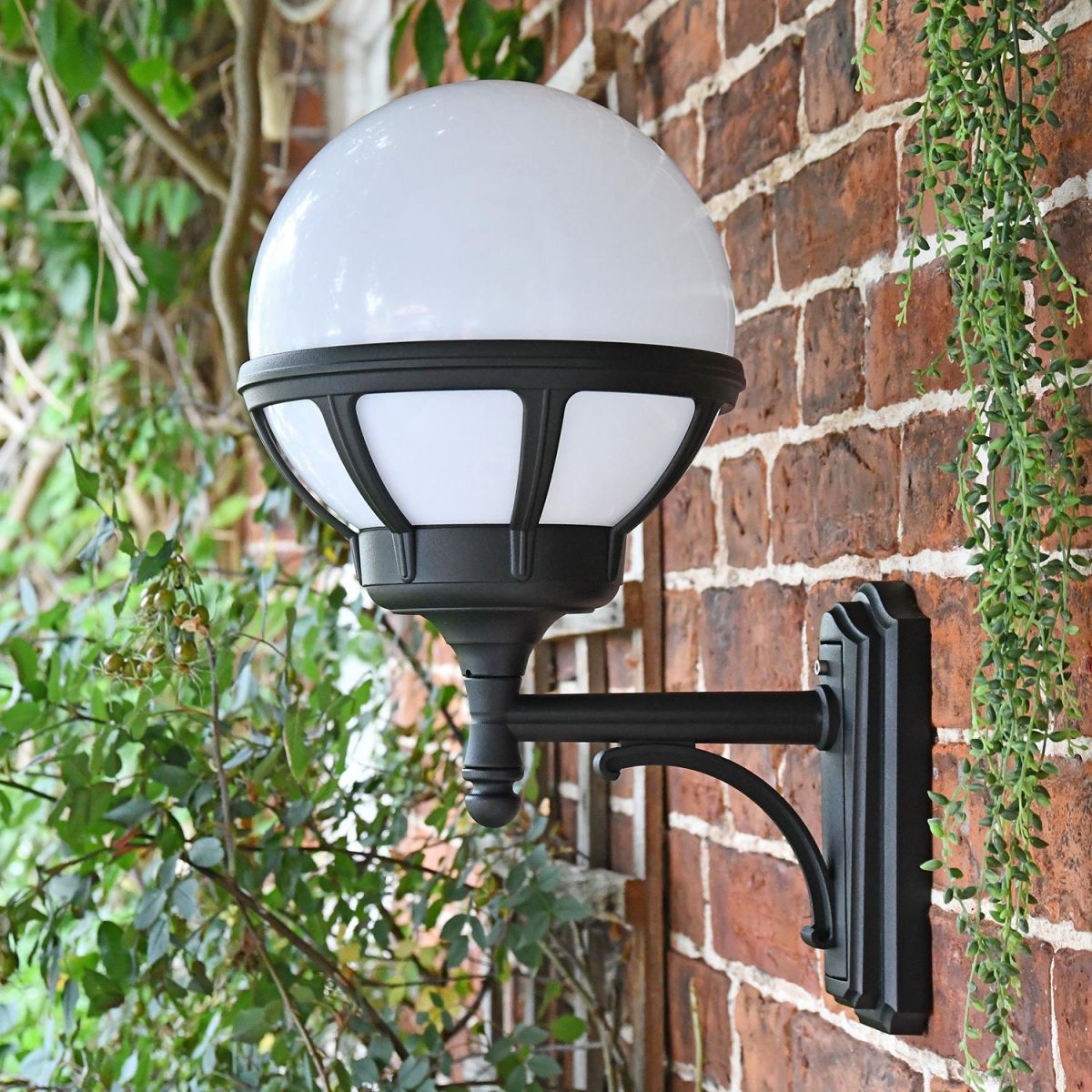 View of the Side of the Traditional Globe Outside Wall Light Mounted on a Brick Wall