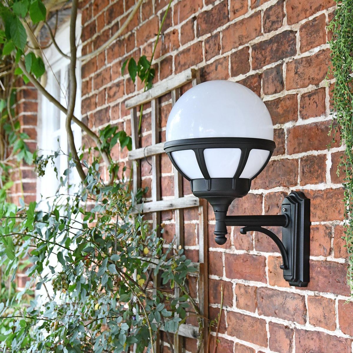 Traditional Globe Outside Wall Light Mounted on a Garden Wall 