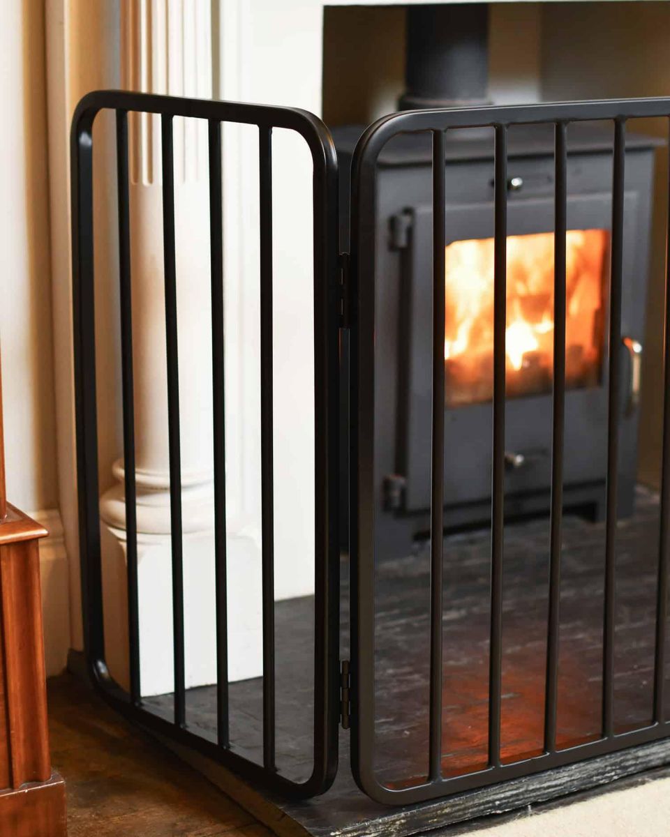 Close-Up of Traditional Large Black Nursery Fire Guard in Situ Close-Up of Traditional Large Black Nursery Fire Guard in Situ