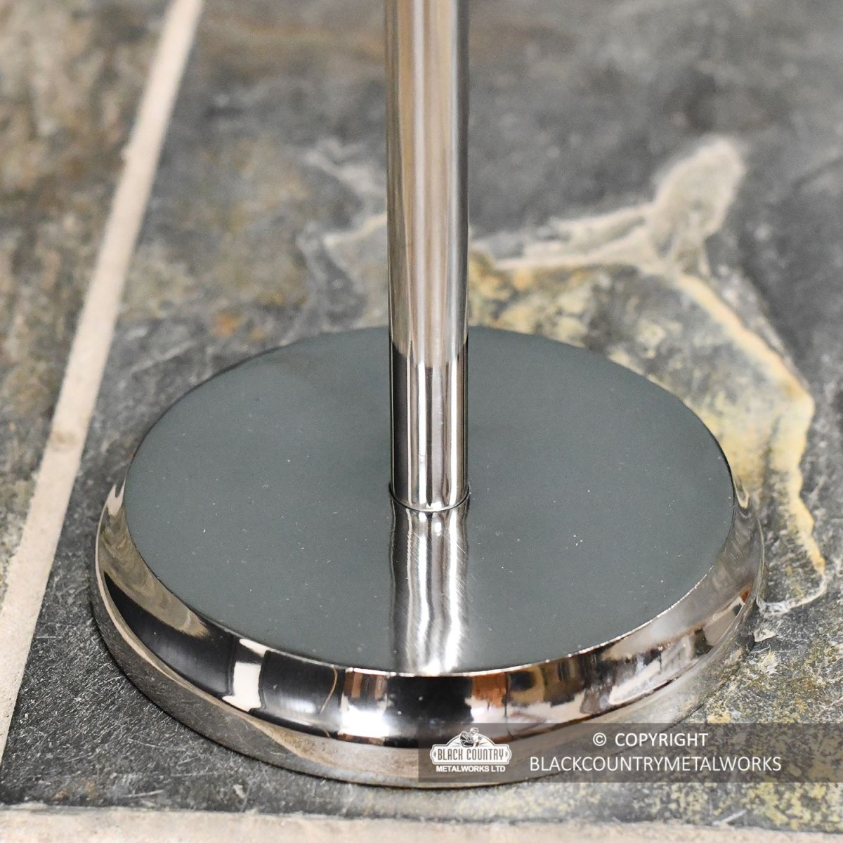 close-up of the round Base Finished in a Polished Steel close-up of the round Base Finished in a Polished Steel