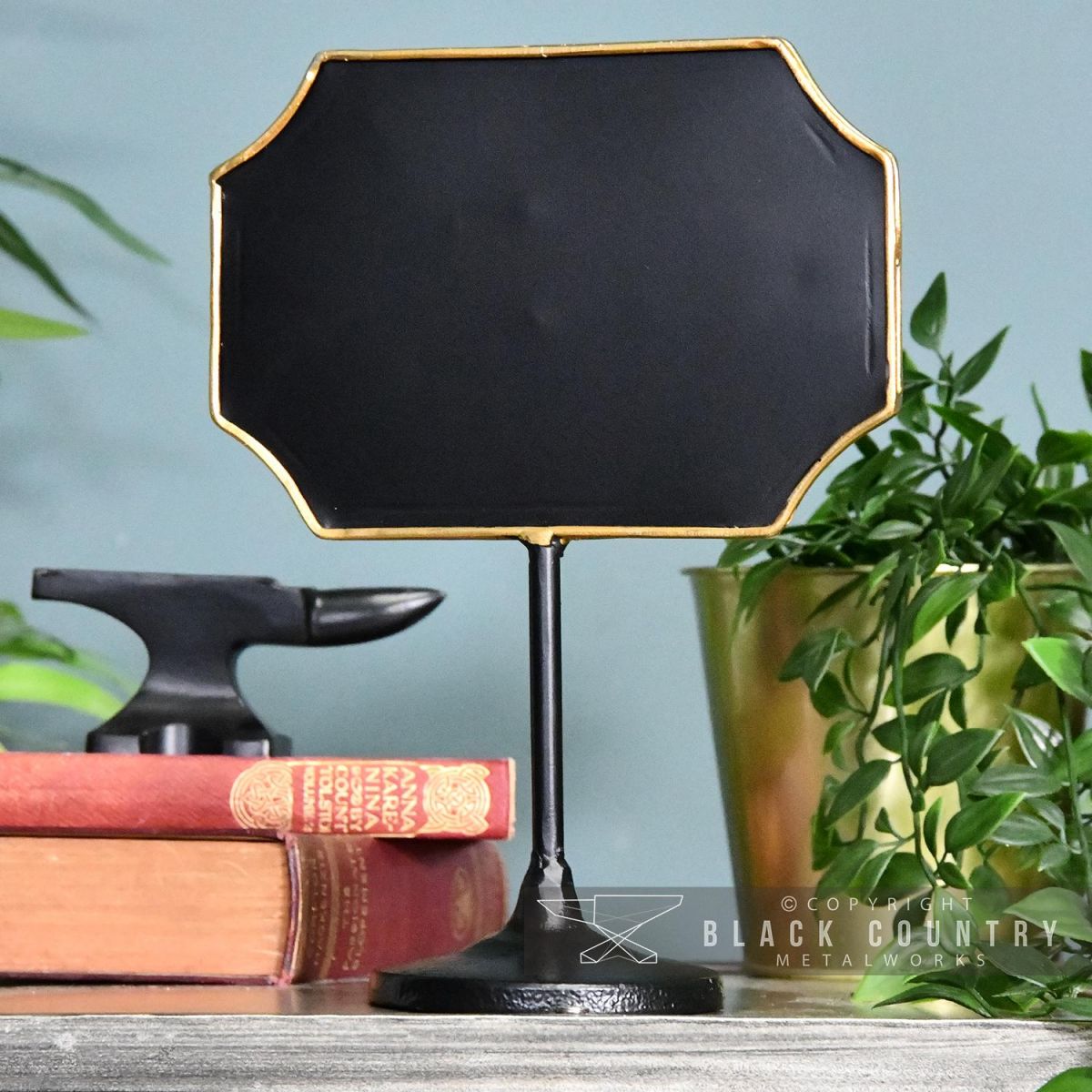 Antique Bronze Vintage Chalk Board Standing by a Blue Wall