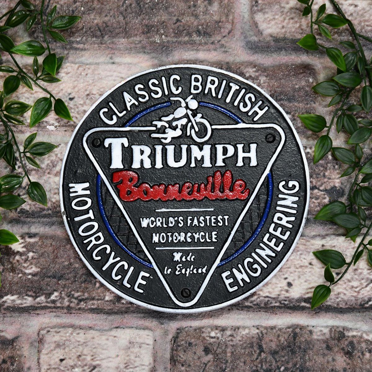 "Classic British Triumph Motorcycles" Cast Iron Vintage Wall Sign in Use Outdoors in the Garden