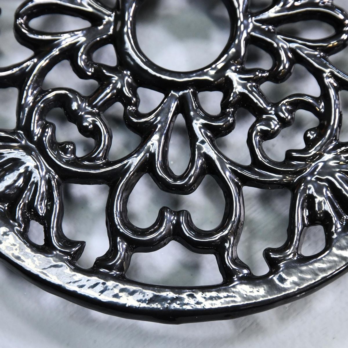 Ornate Design on the Black Heavy Duty Cast Iron Round Trivet