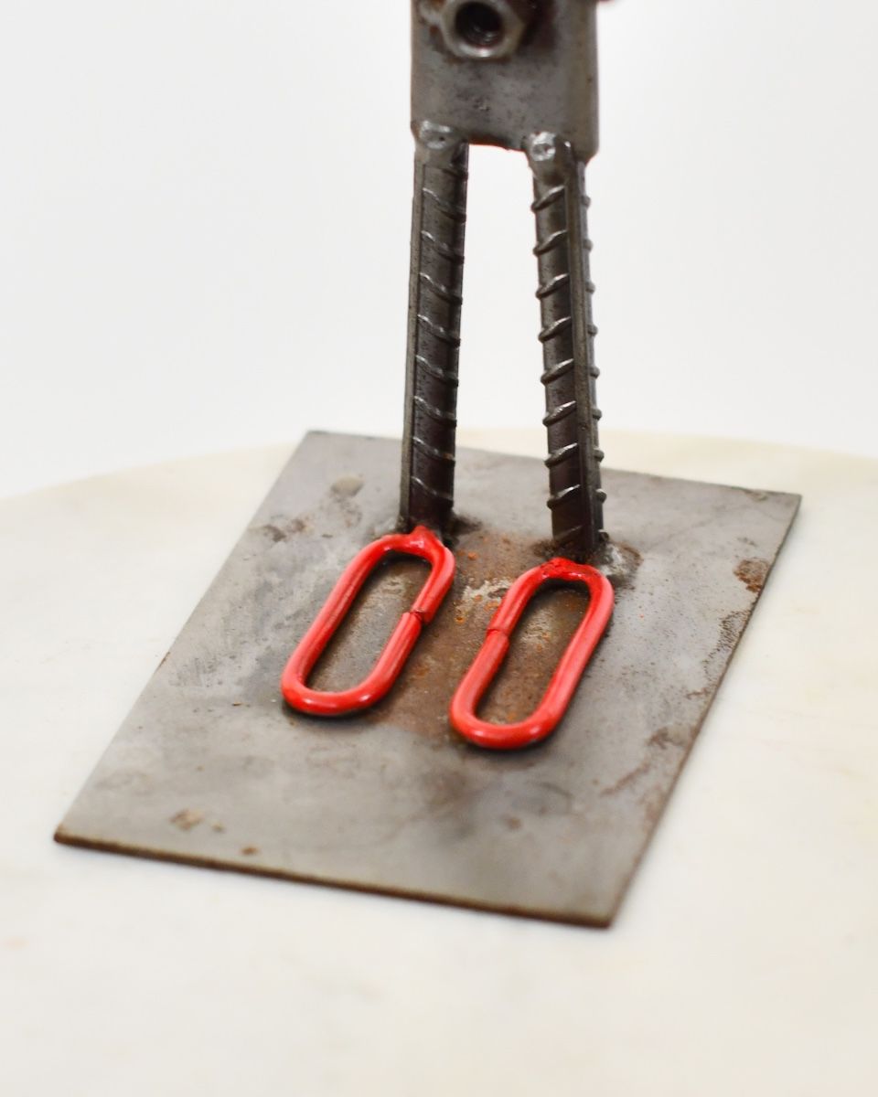 Tuppence the Clown Upcycled Metal Ornament close up of base made from chain links