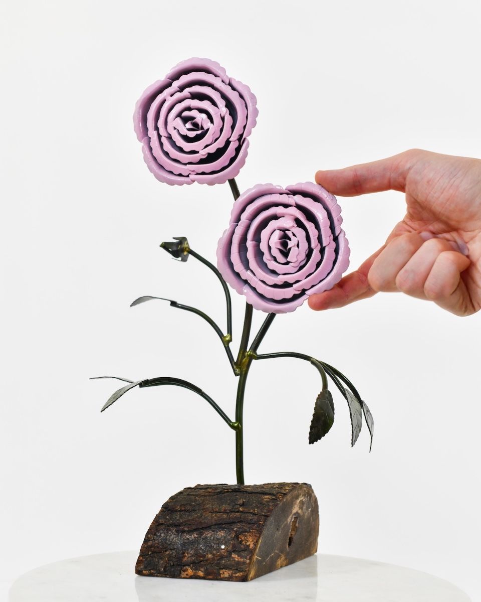 Twin bloom Upcycled Steel Botanical Sculpture in Wooden Base - Pink with hand in shot for scale
