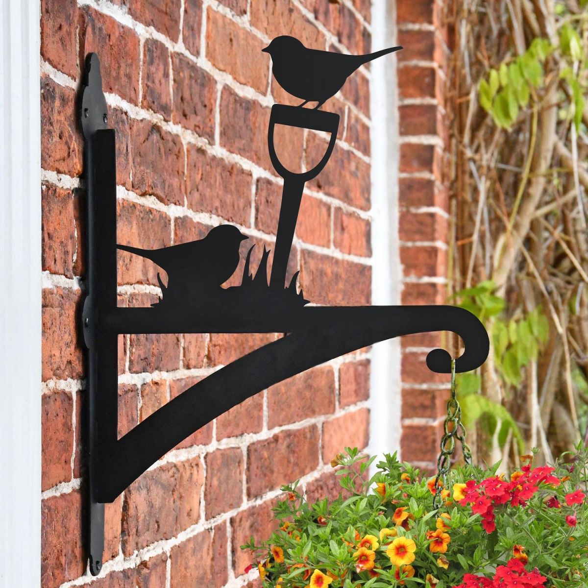Robin on Garden Shovel Hanging Basket Bracket in Situ on a Brick Wall