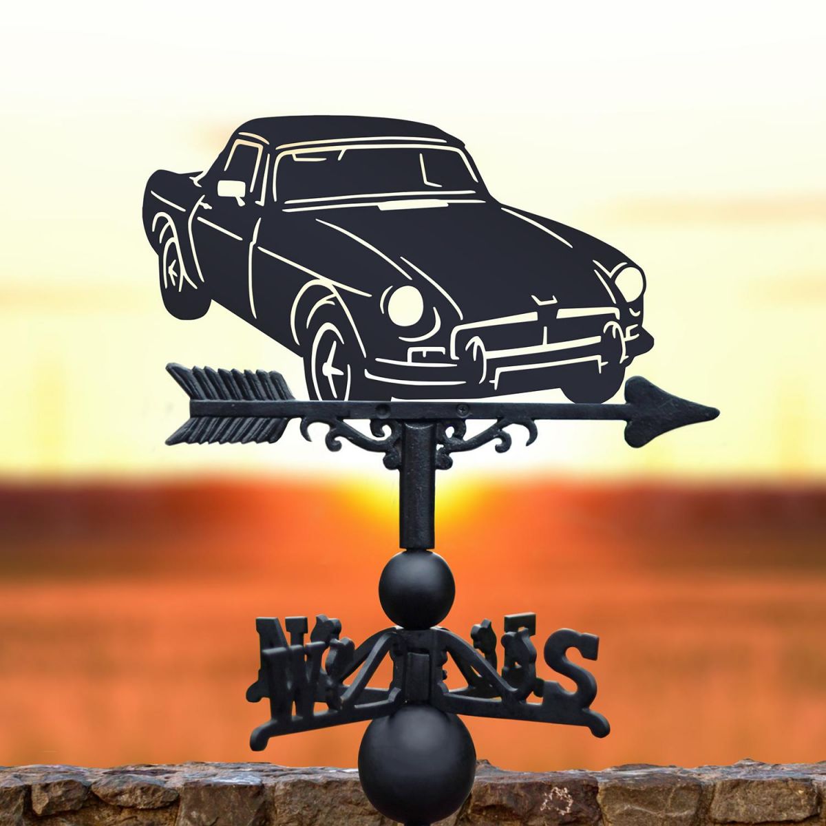 Black MGB Roadster Weathervane on sunset background