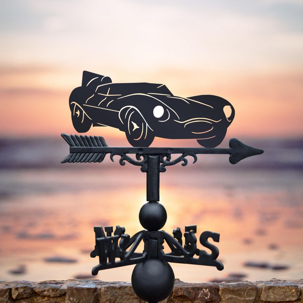 Jaguar D-Type Weathervane in Use in the Sunset Jaguar D-Type Weathervane in Use in the Sunset