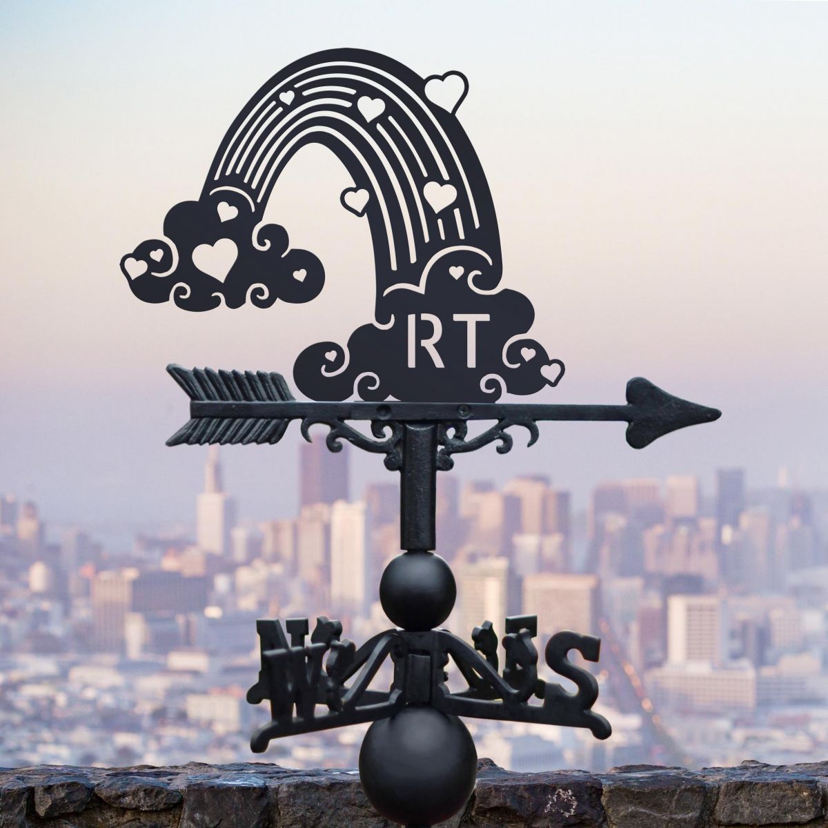 Rainbow Personalised Initials Weathervane ion display in an Urban Setting