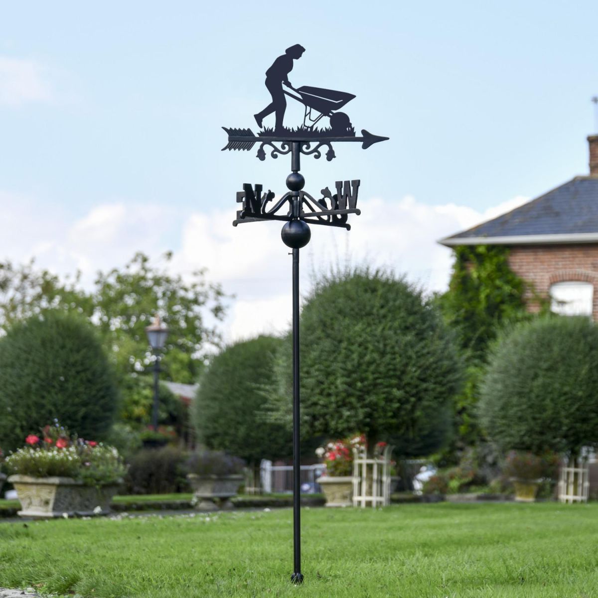 Wheelbarrow Gardener Free Standing Weathervane in Situ