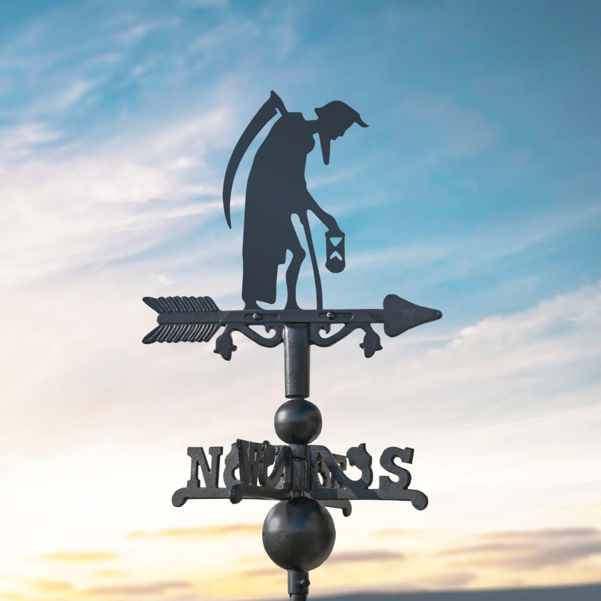 Old Father Time on Miniature Weathervane at Dusk