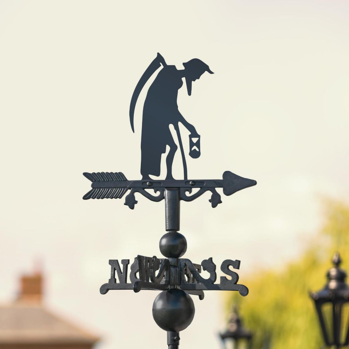 Miniature Old Father Time Weathervane in Garden