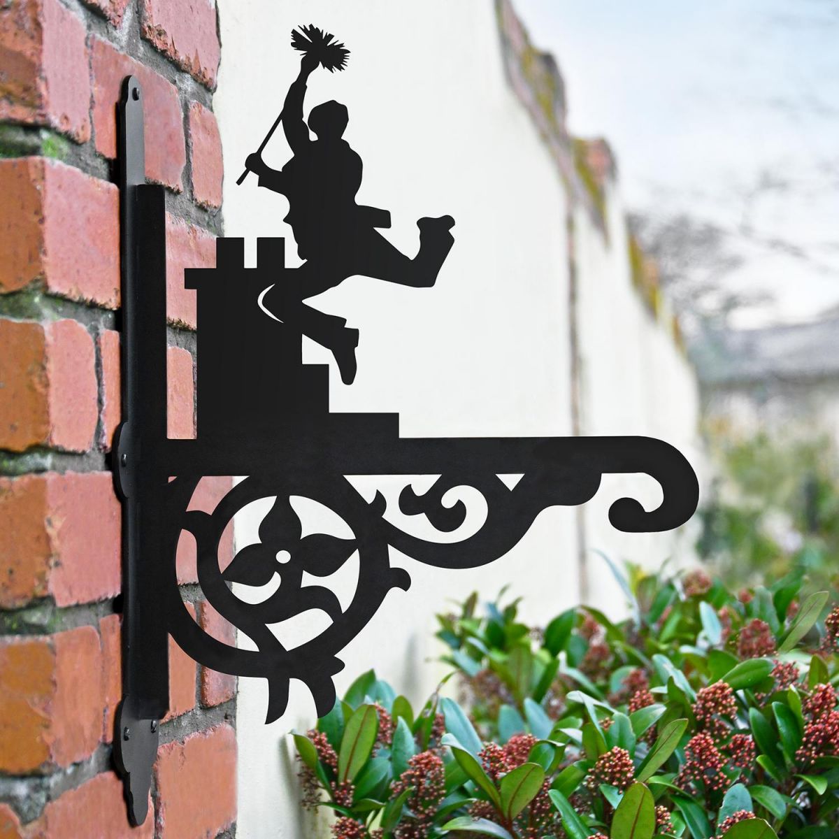 Ornate Chimney Sweep Hanging Basket Bracket in Situ in the Garden Ornate Chimney Sweep Hanging Basket Bracket in Situ in the Garden