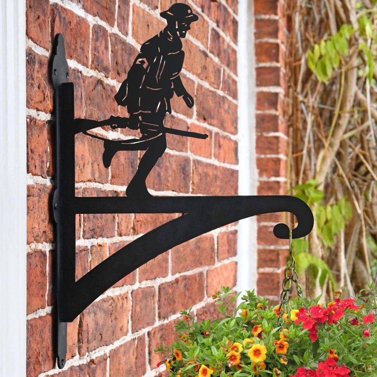 Running Soldier Hanging Basket Bracket on a Brick Wall in the Garden Running Soldier Hanging Basket Bracket on a Brick Wall in the Garden
