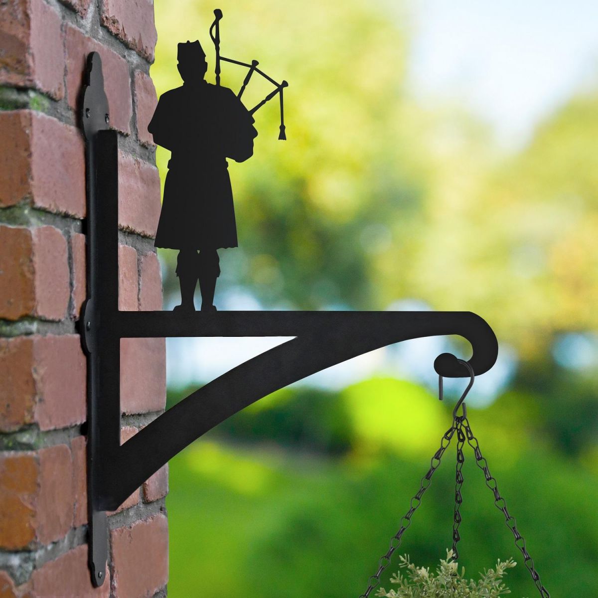 Scottish Bagpiper Hanging Basket Bracket in Garden Scottish Bagpiper Hanging Basket Bracket in Garden