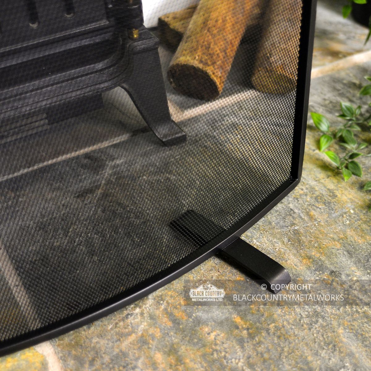 Close-up of the Feet on the Bottom of the Fire Screen