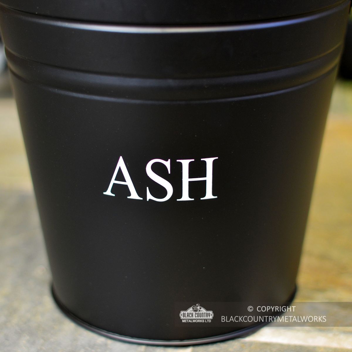 Close-up of the Word Ash on the Contemporary Ash Bucket