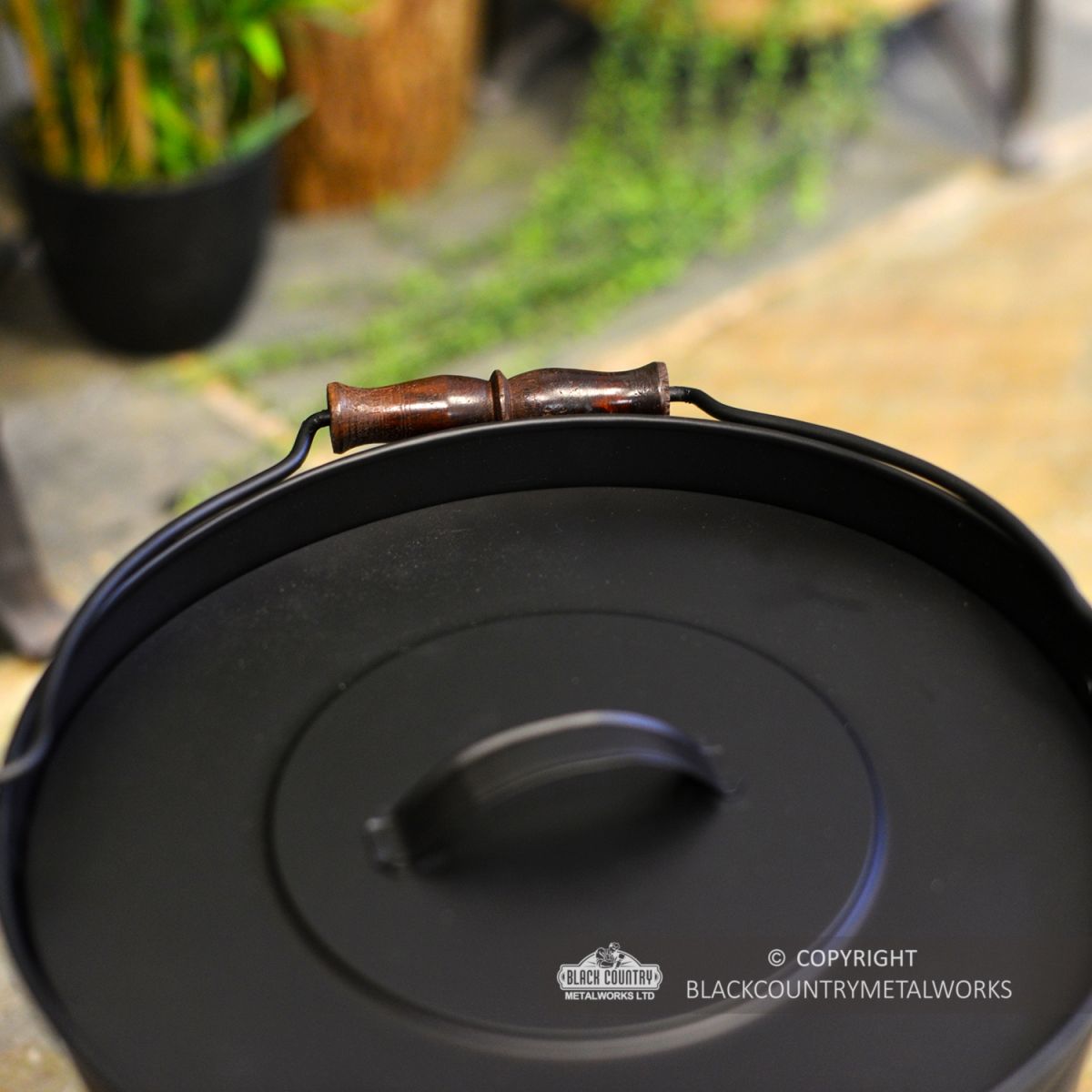 Wooden Carry Handle on the Ash Bucket