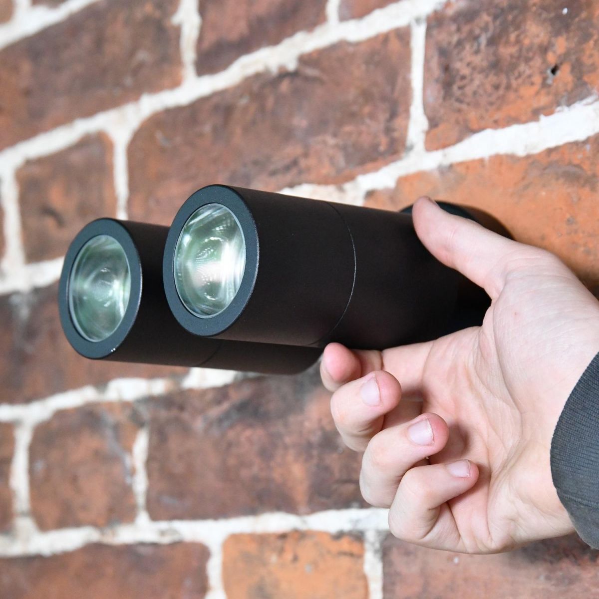 Black Dual Cylinder Downlight with hand for scale  Black Dual Cylinder Downlight with hand for scale