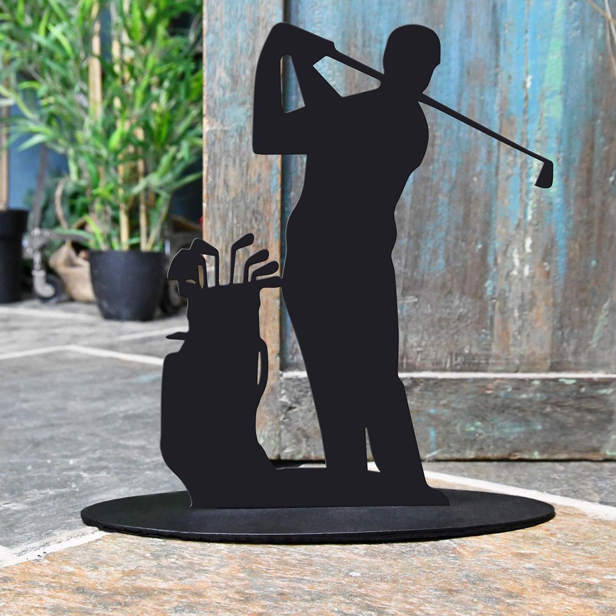 Golfer Iron Door Stop Next to a Rustic Blue Door Golfer Iron Door Stop Next to a Rustic Blue Door