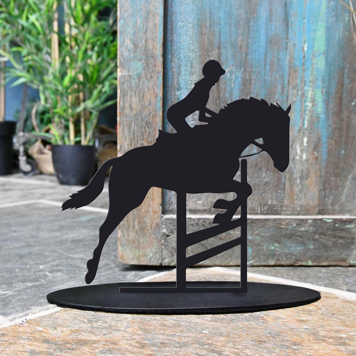Showjumping Horse Iron Door Stop Next to a Rustic Blue Door