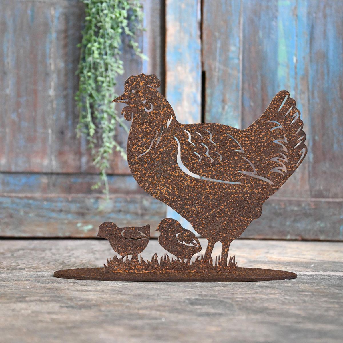 Hen & Chicks Rustic Iron Door Stop in Front of a Rustic Blue Door Hen & Chicks Rustic Iron Door Stop in Front of a Rustic Blue Door