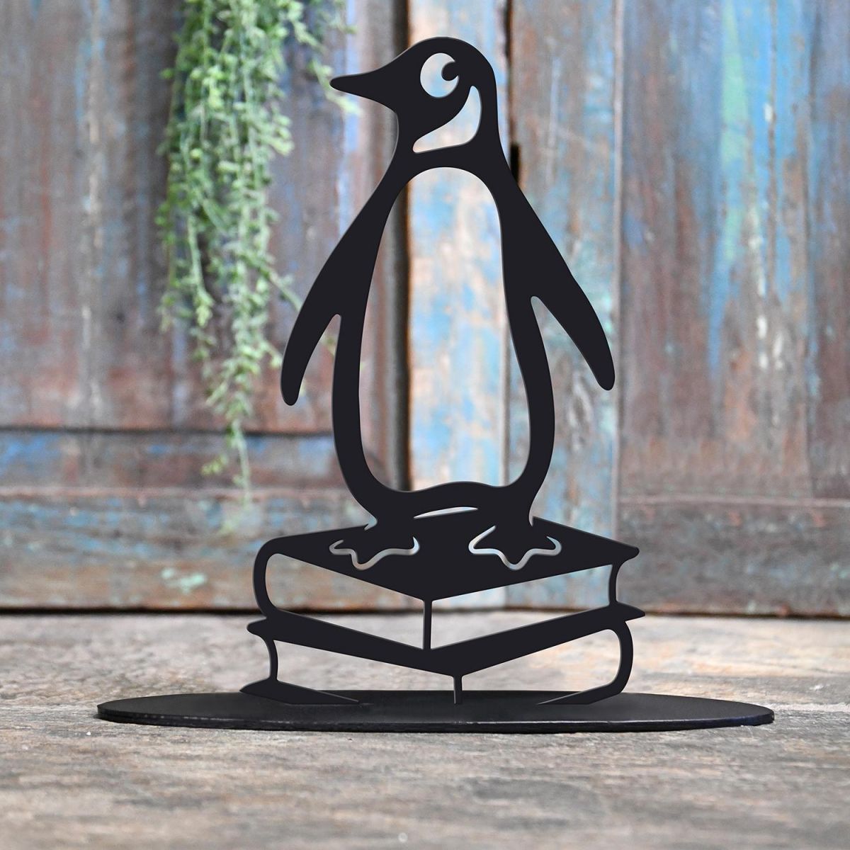 Penguin on Books Iron Door Stop in Black