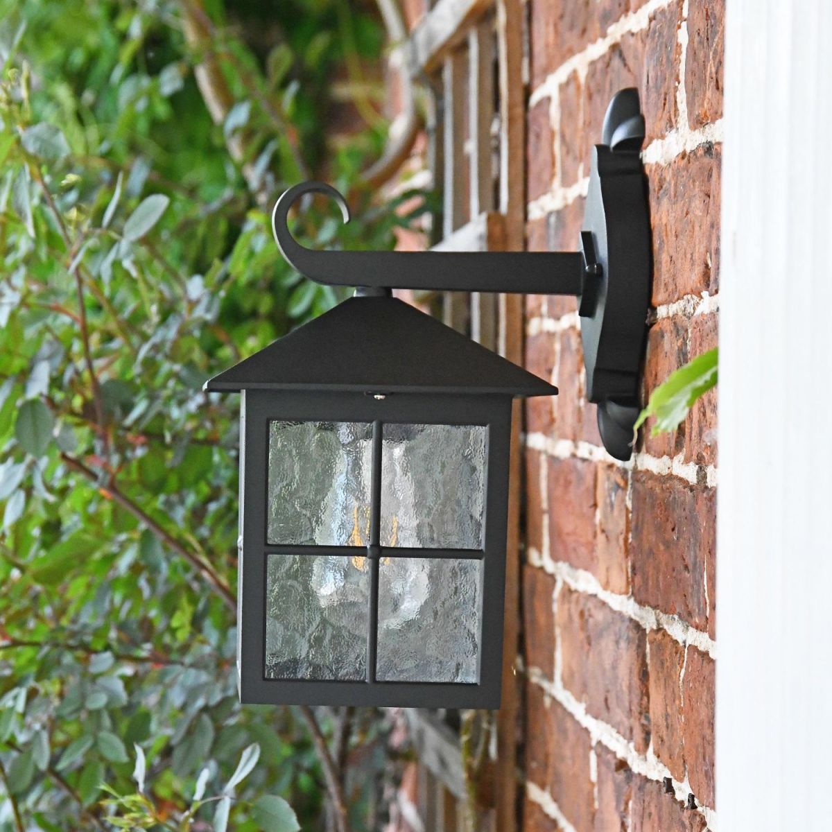 Bird house shaped lantern with textured window panes Bird house shaped lantern with textured window panes