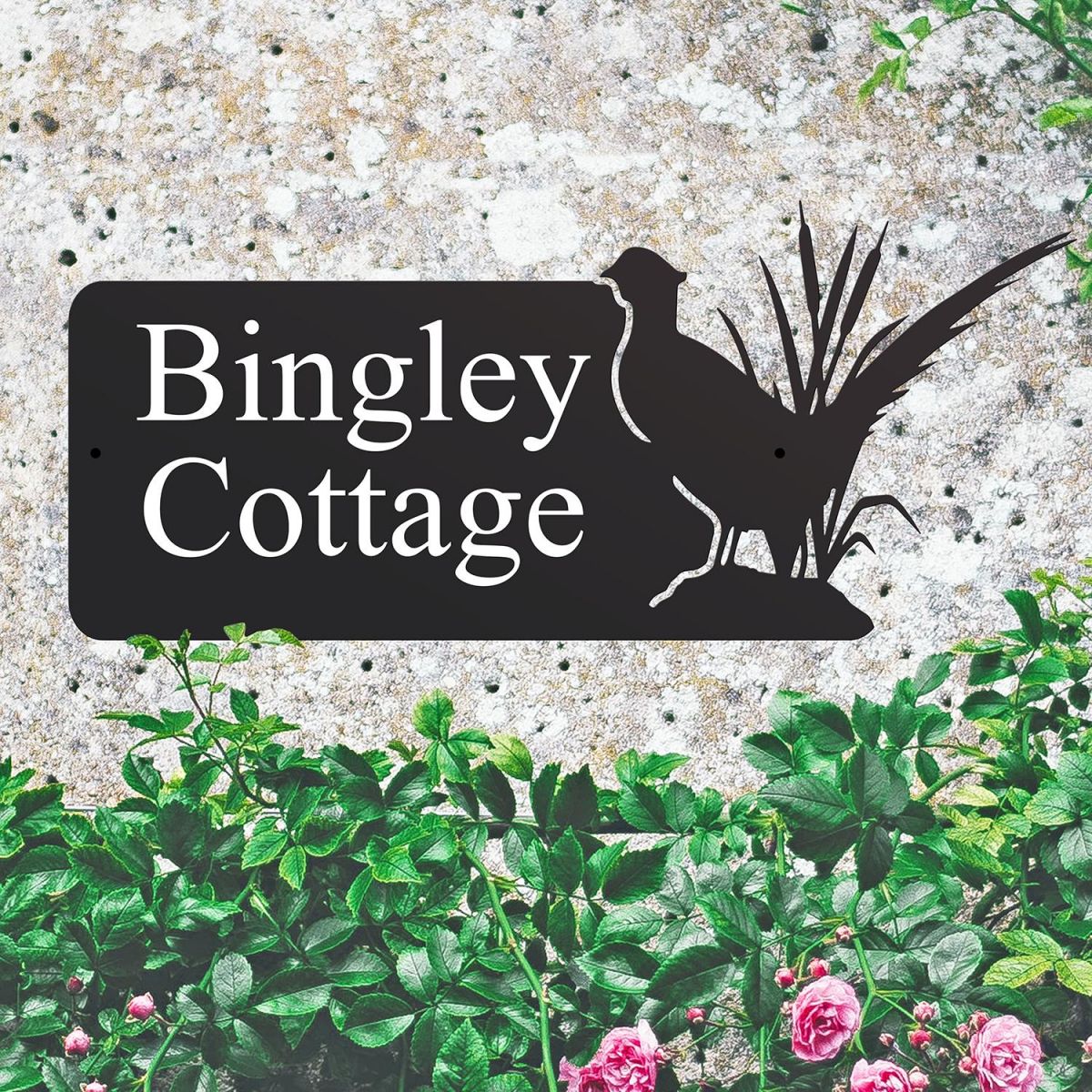 Pheasant Iron House Name Sign on a Stone Wall