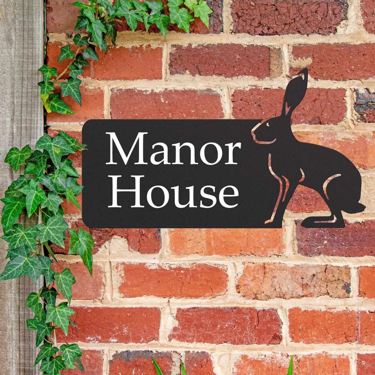 Hare House Name Sign on Brick Wall  Hare House Name Sign on Brick Wall