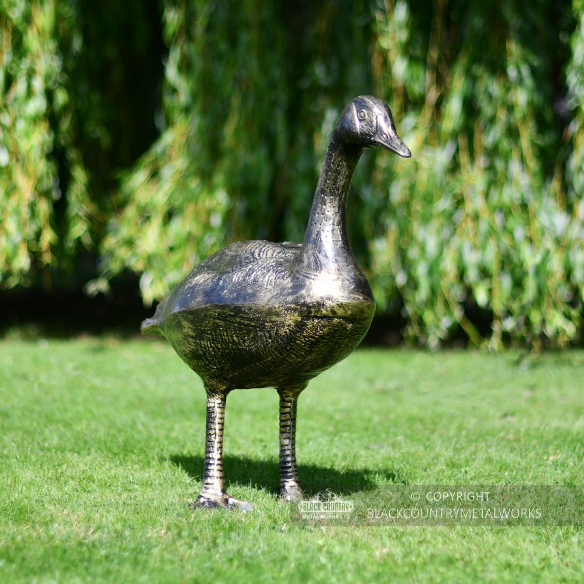 Looking Up Bronze Finish Geese Garden Sculpture On Front Lawn