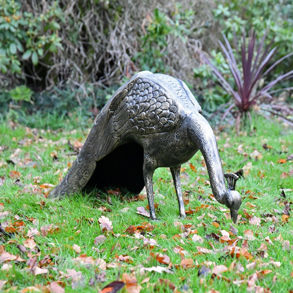 Peacock sculpture head down 