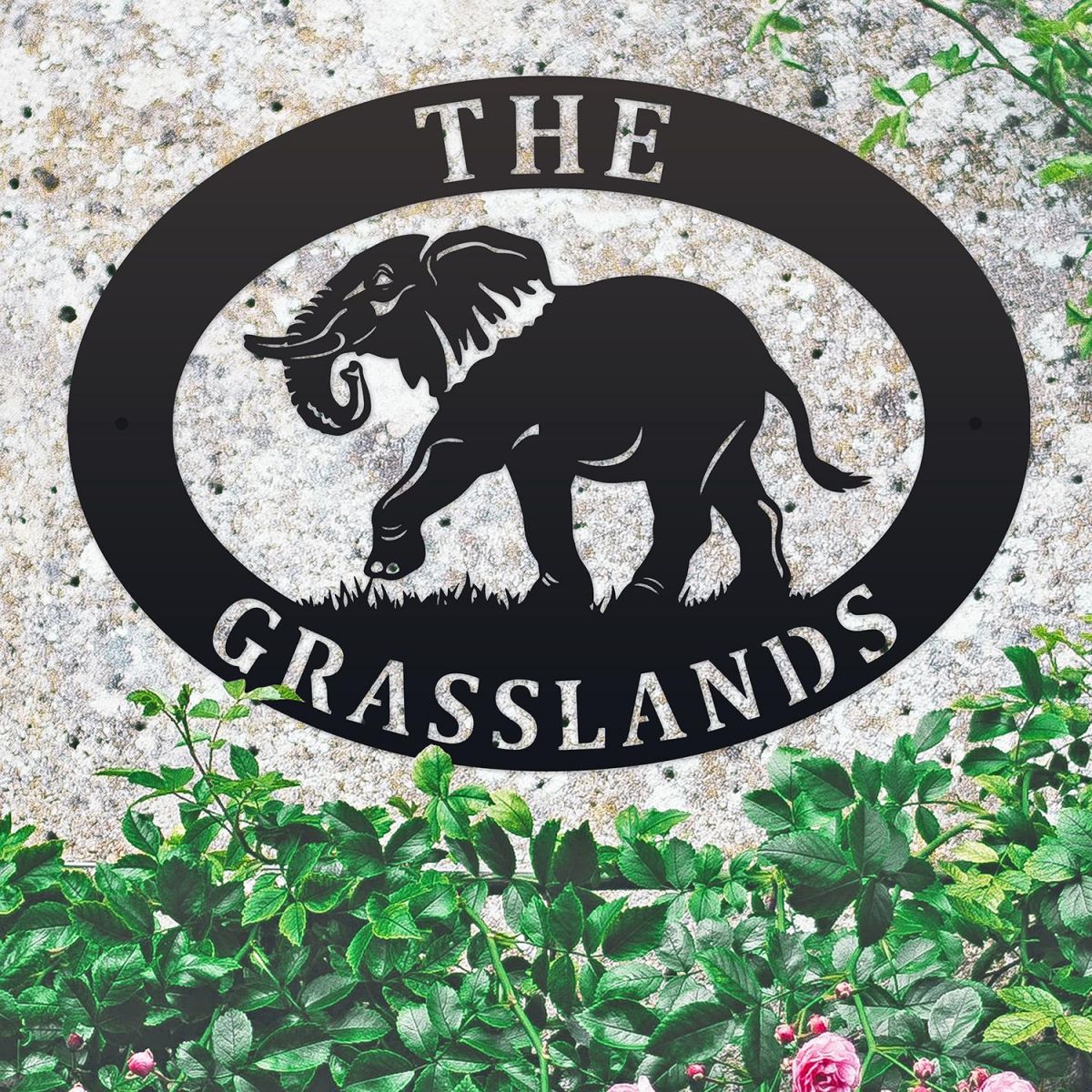 Elephant Iron Oval House Sign on a Stone Wall