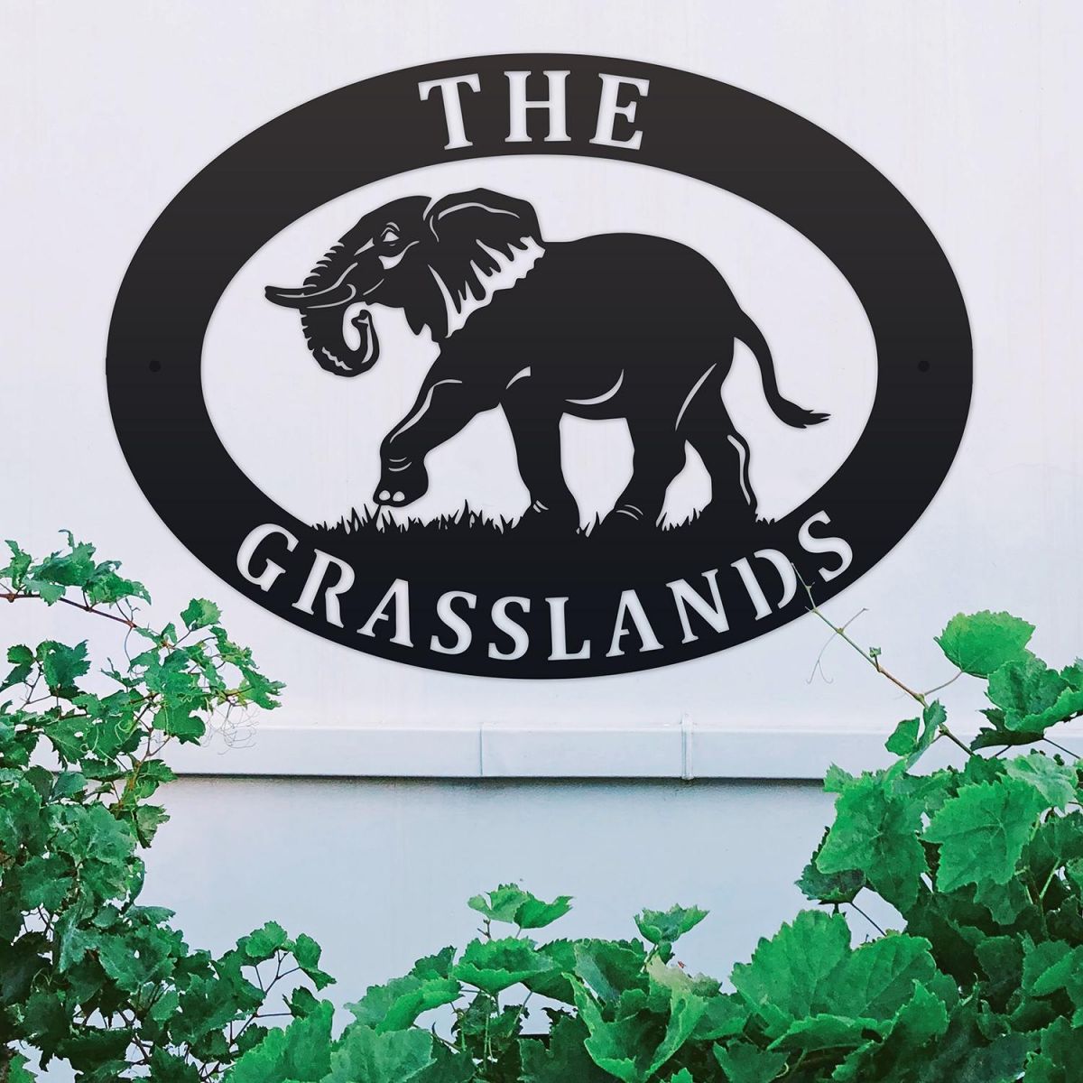 Elephant Iron Oval House Sign on a White Wall