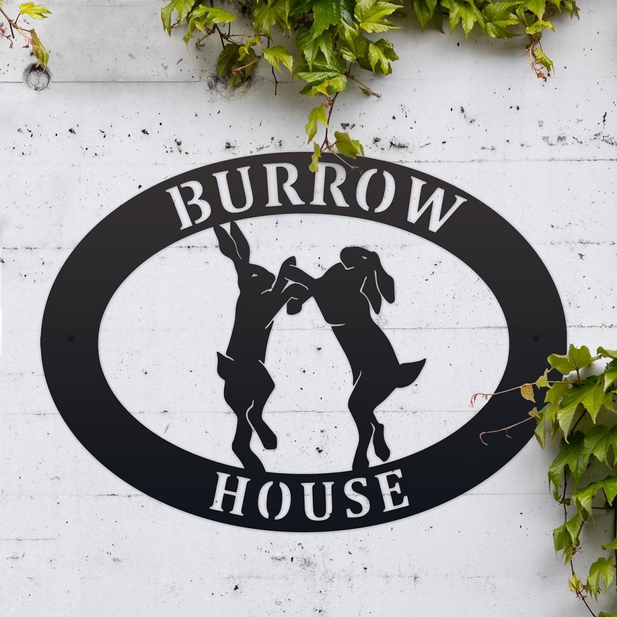 Boxing Hares Iron Oval House Sign in Use Outdoors