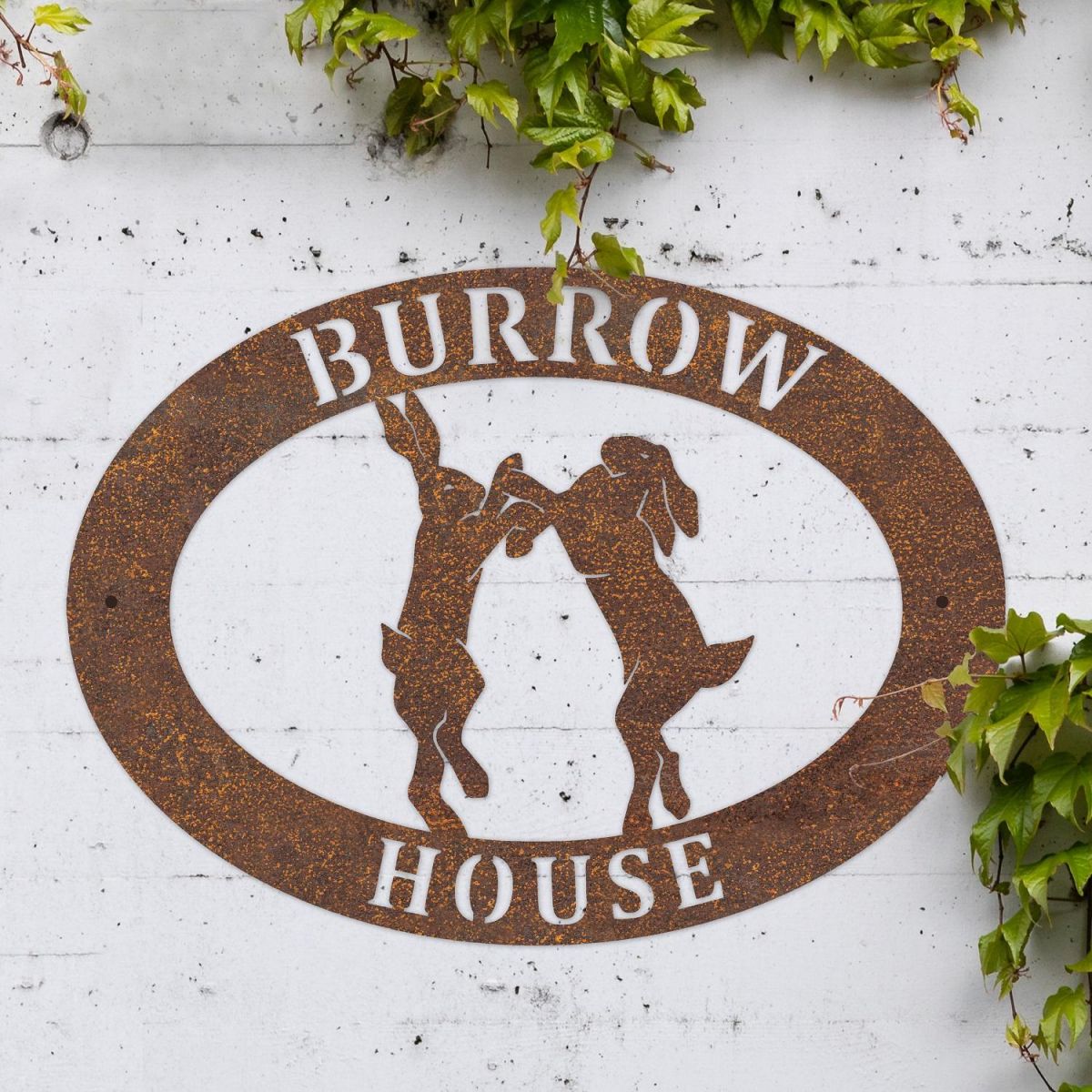 Boxing Hares Iron Oval House Sign in Situ