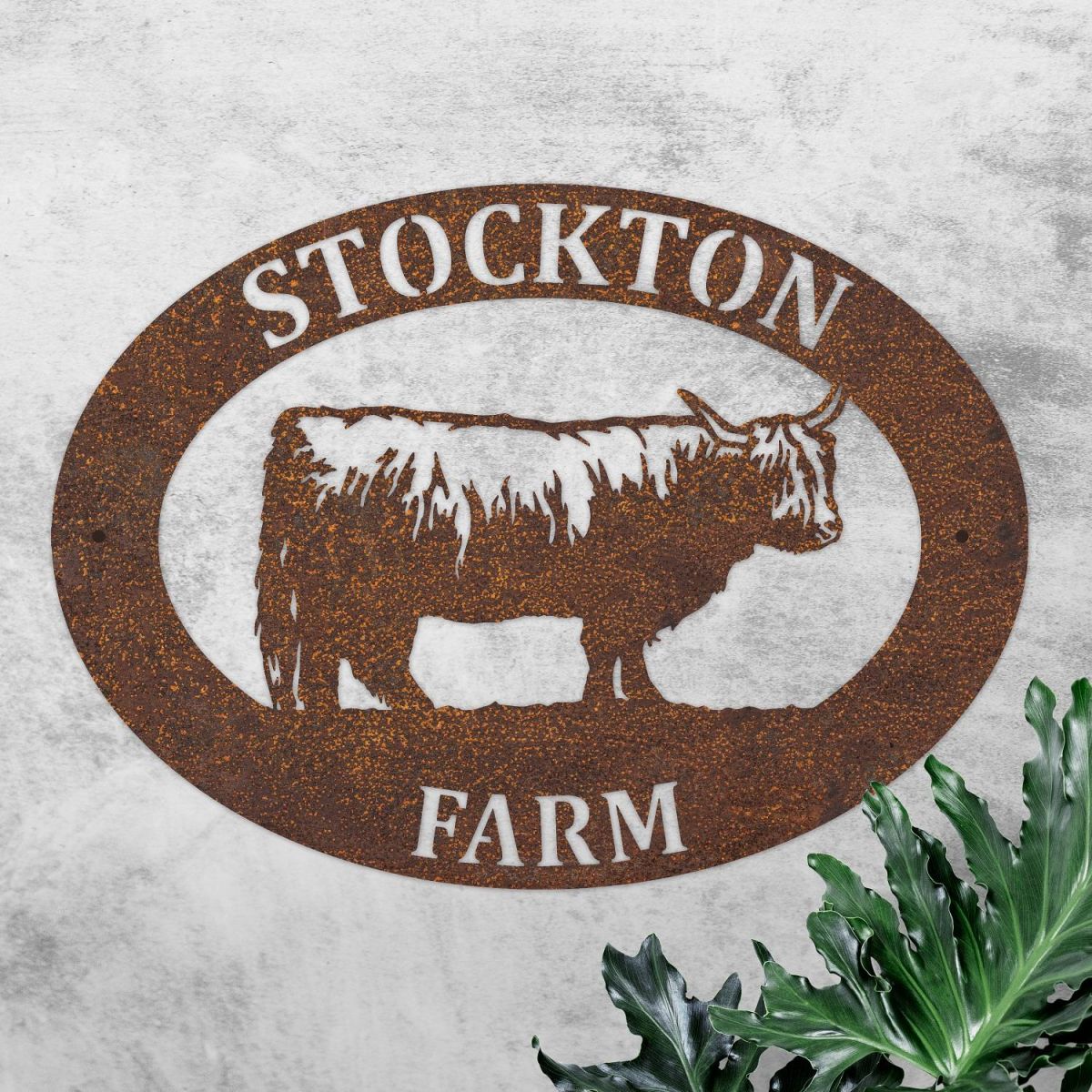 Highland Cow Iron Oval House Sign in Use Outdoors