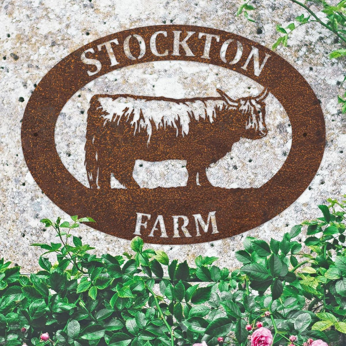 Highland Cow Iron Oval House Sign on a Stone Wall
