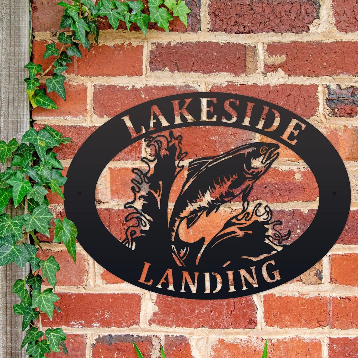 Freshwater Salmon Iron Oval House Sign on a Brick Wall