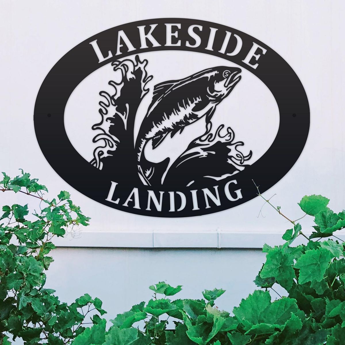 Freshwater Salmon Iron Oval House Sign on a White Wall