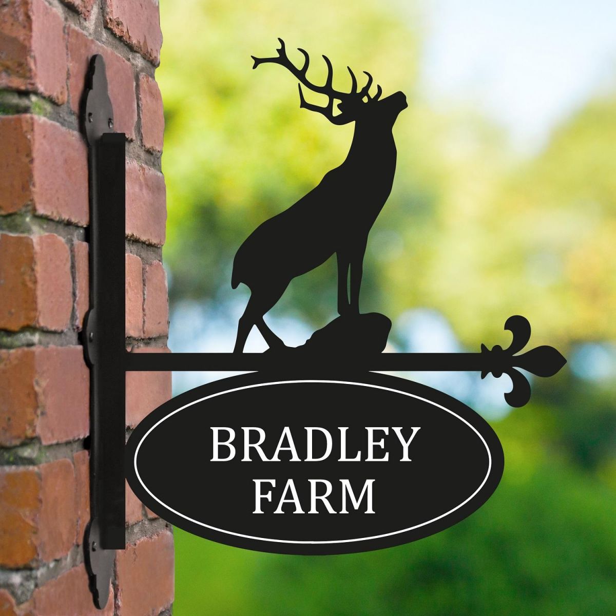 Stag Iron Bracketed House Name Sign on Brick Wall  Stag Iron Bracketed House Name Sign on Brick Wall