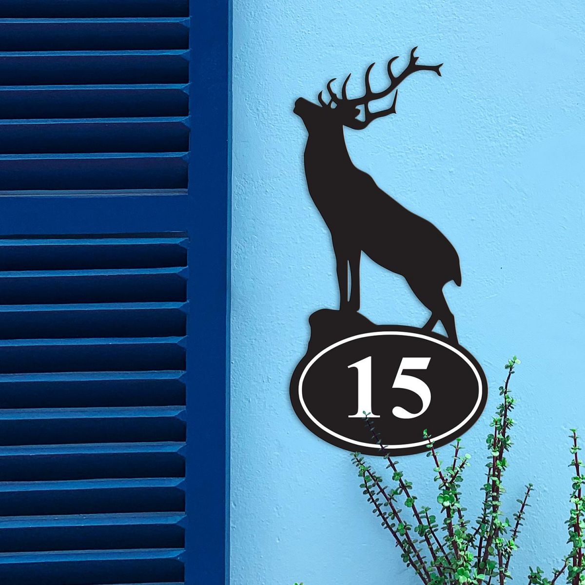 Stag Iron House Number Sign in Situ on a Blue Wall