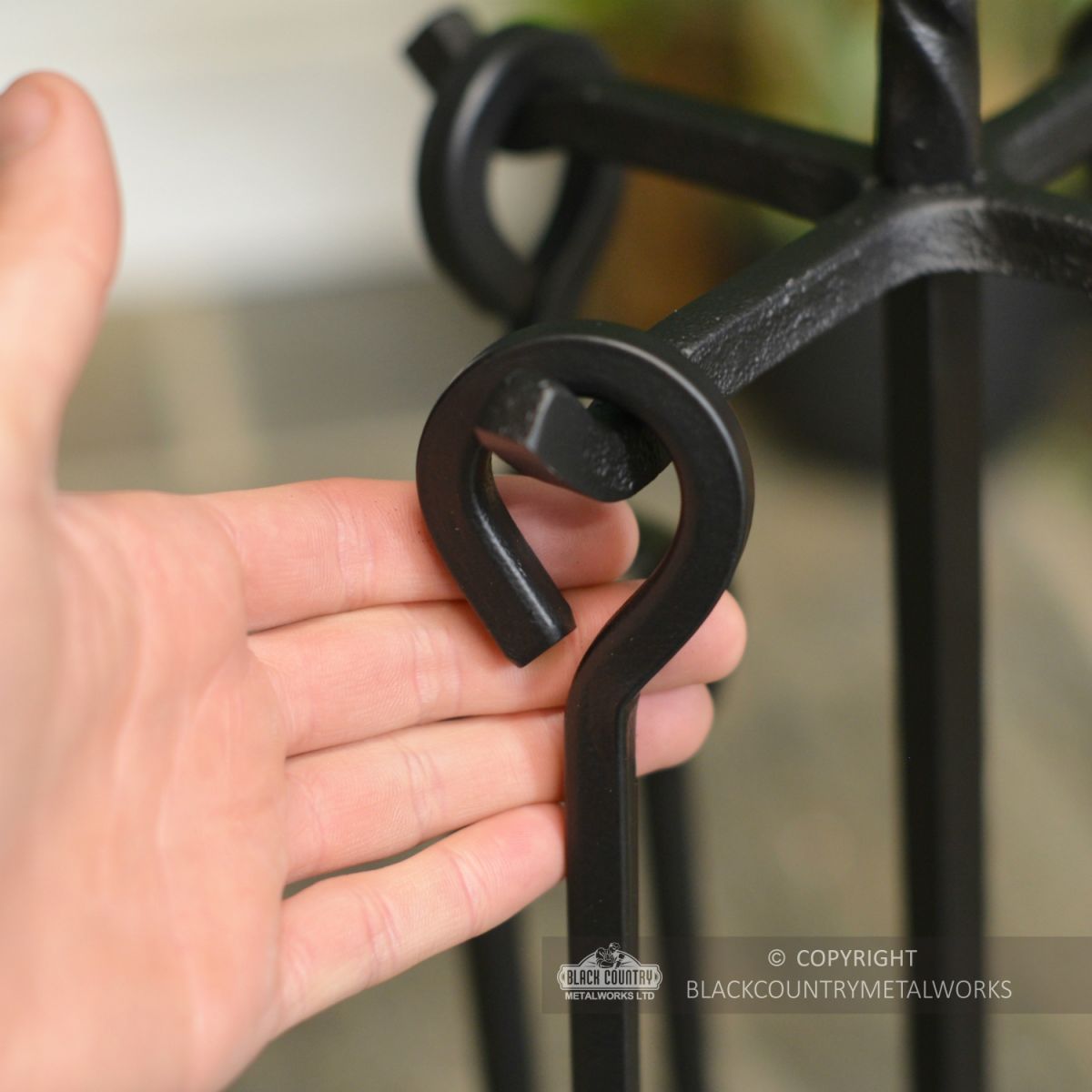 Close Up Of Fireside Tools Wit Rope Twists