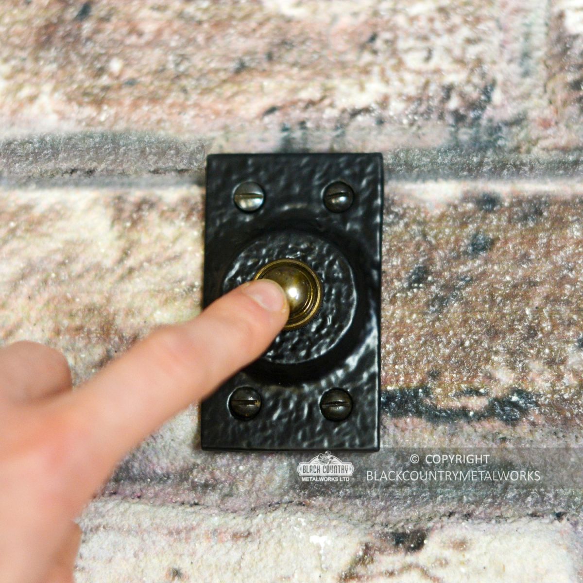 Black Traditional Rectangular Door Bell Push to Scale