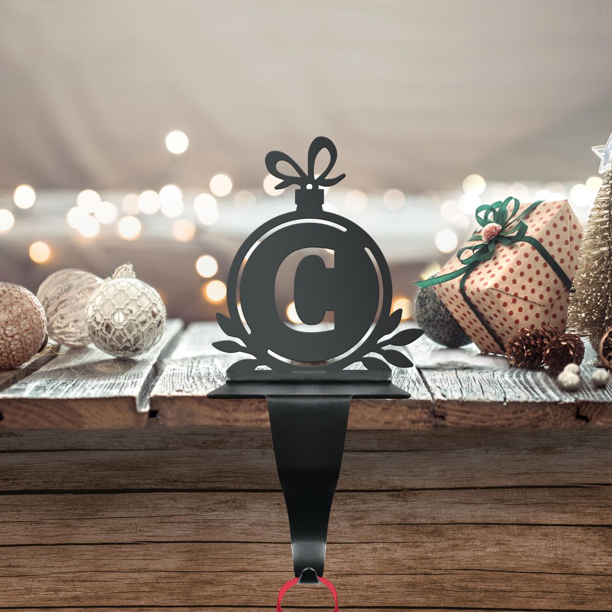 Letter C Stocking Holder in Situ on a Mantel Piece 