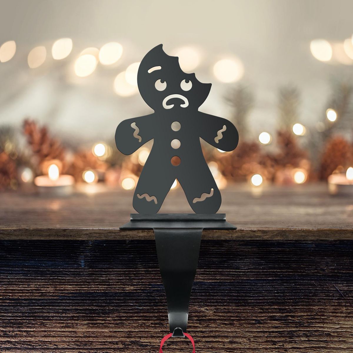 Bitten Gingerbread Man Stocking Holder in Situ with Fairy Lights