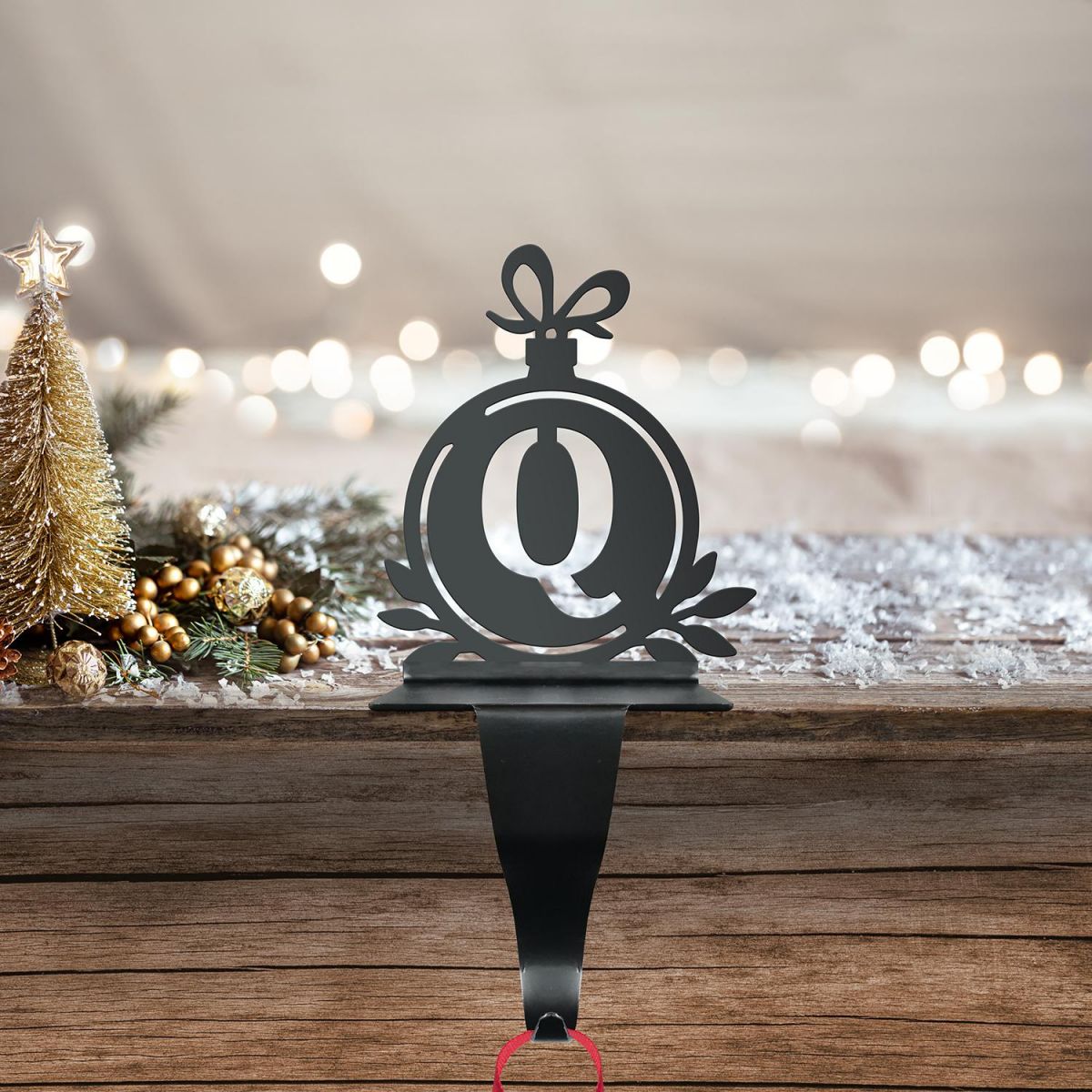 Letter Q Stocking Holder in Situ on a Mantel Piece 