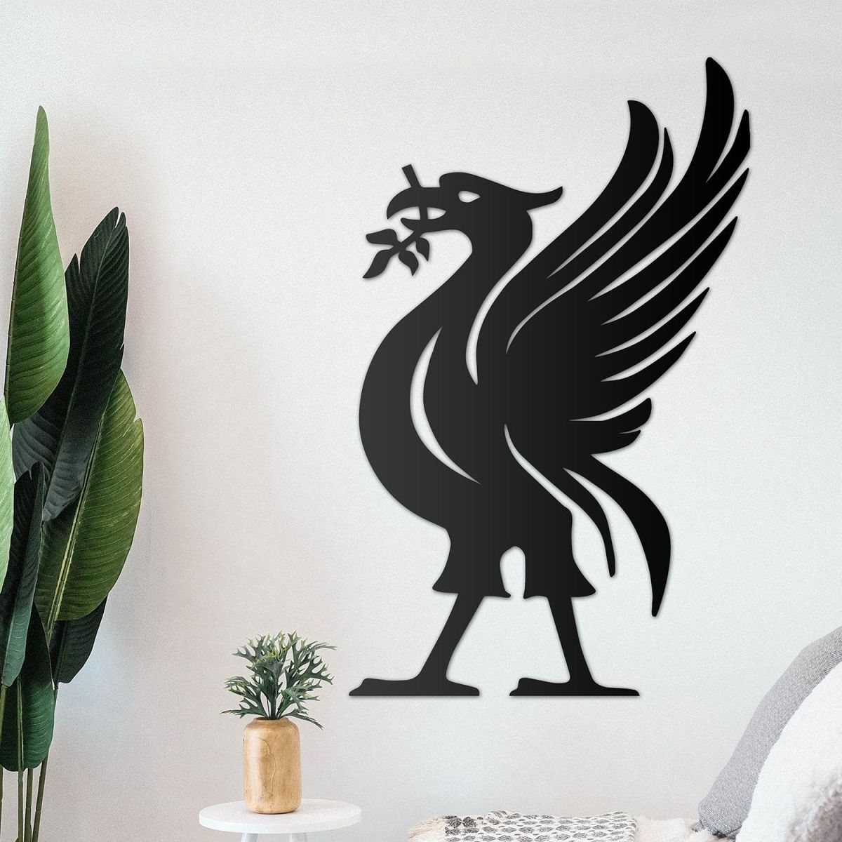 Liver Bird Wall Art on the Wall Next to Plants Liver Bird Wall Art on the Wall Next to Plants