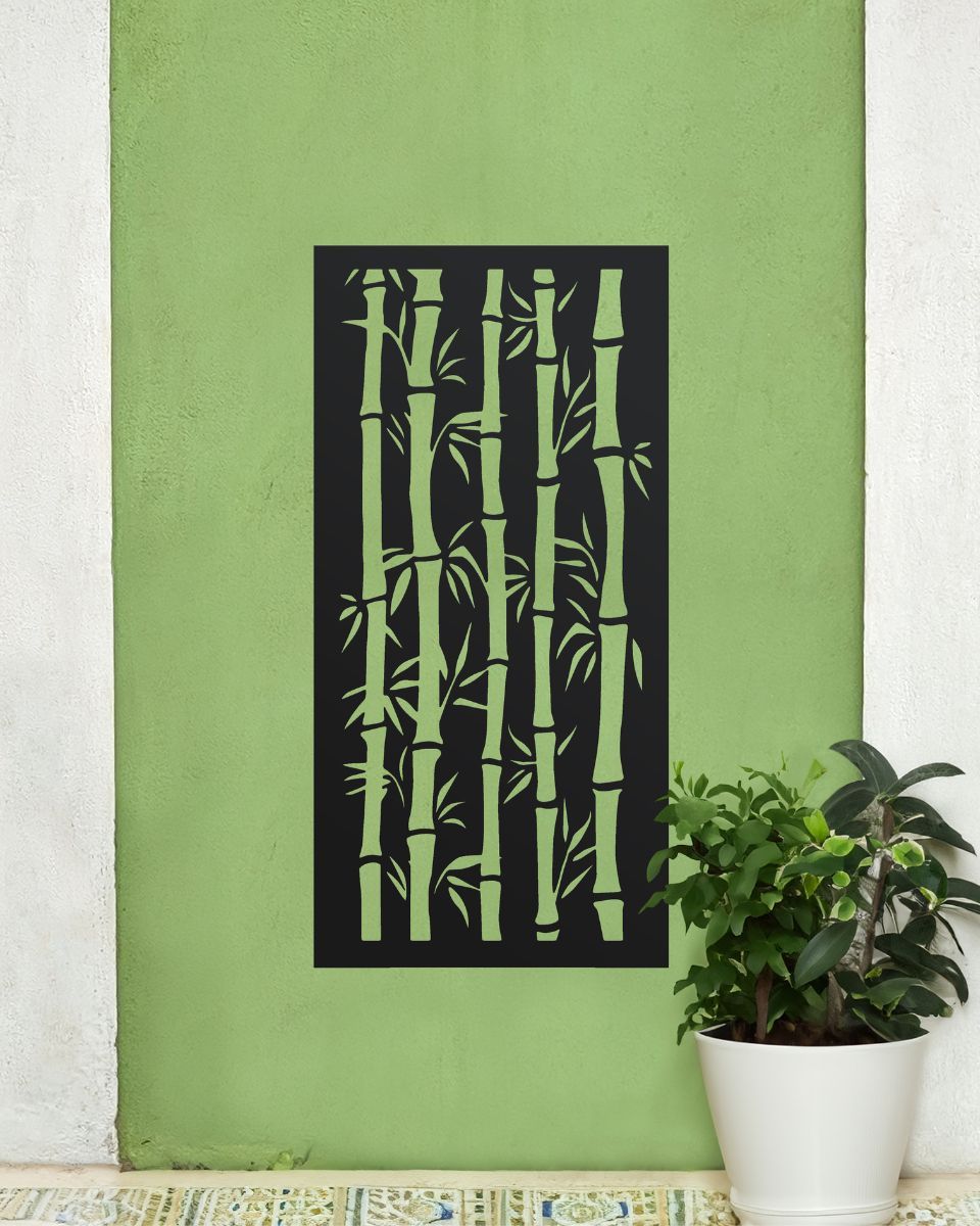Black "Bamboo Garden Wall Art" on a green garden wall next to a potted plant Black "Bamboo Garden Wall Art" on a green garden wall next to a potted plant